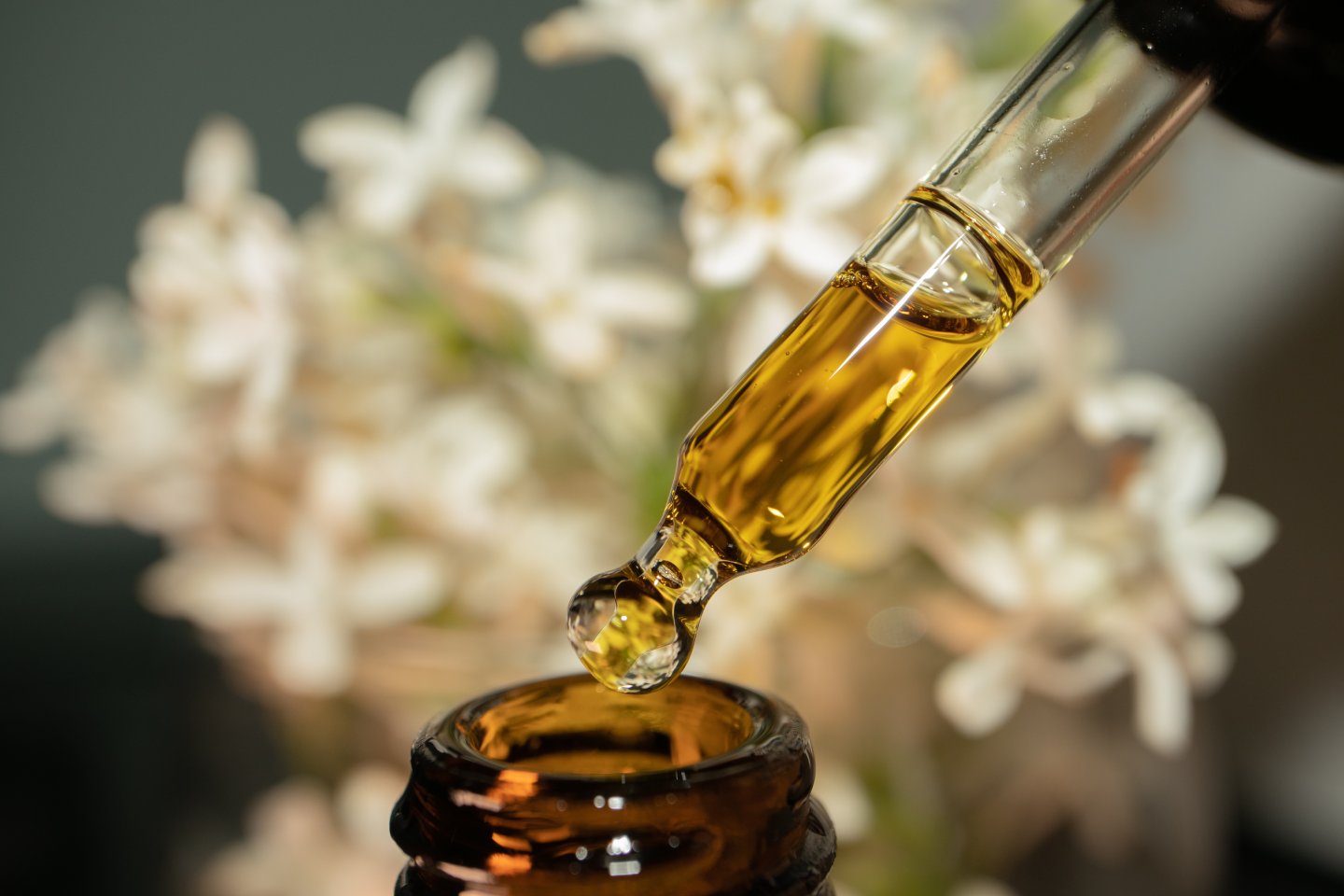 CBD tincture bottle with dropper and hemp leaves